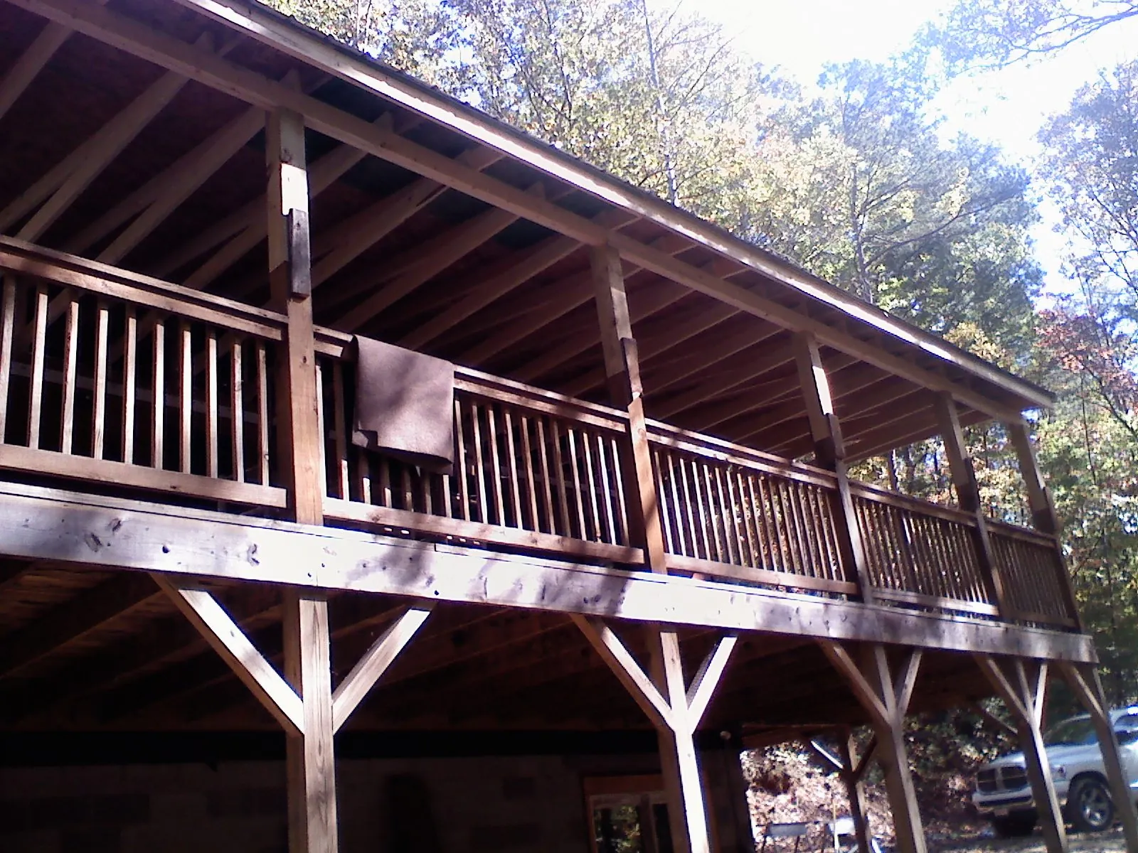 Timber framing under a new elevated porch and deck in Barnstead